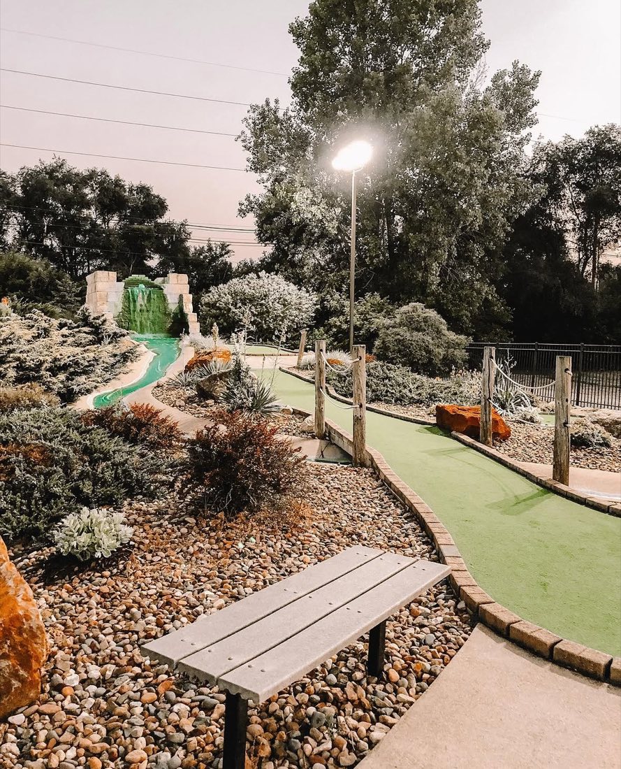 A landscaped hole on the ROC mini golf course at dusk